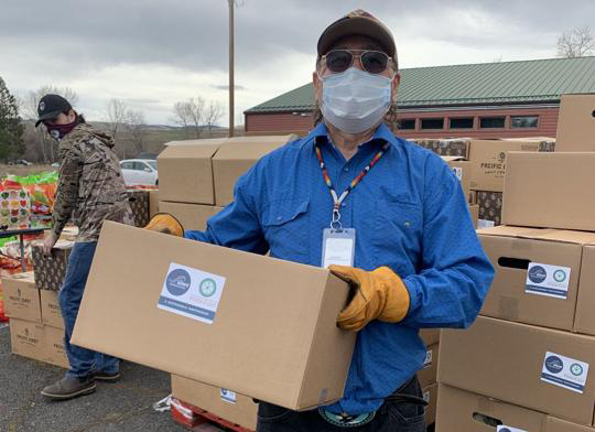 Man holding food boxes