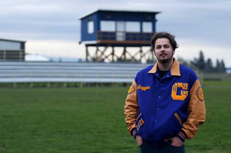 Boy on high school football field