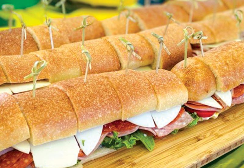 Subway sandwiches ready to go into boxed lunches.
