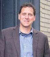 a man poses for a portrait