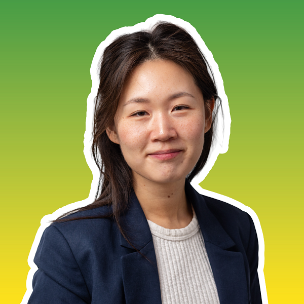 portrait of a smiling woman with a gradient in background