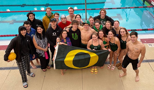 UO Club Swim Team by the pool