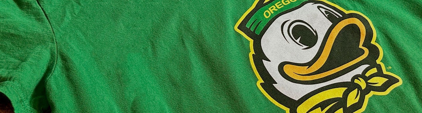 the mascot Duck mark on a green t-shirt