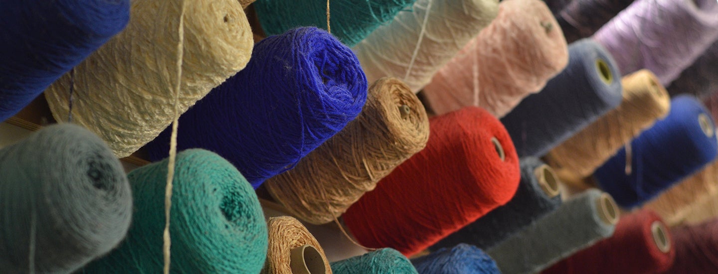 Spools of colored yarn available for student use.