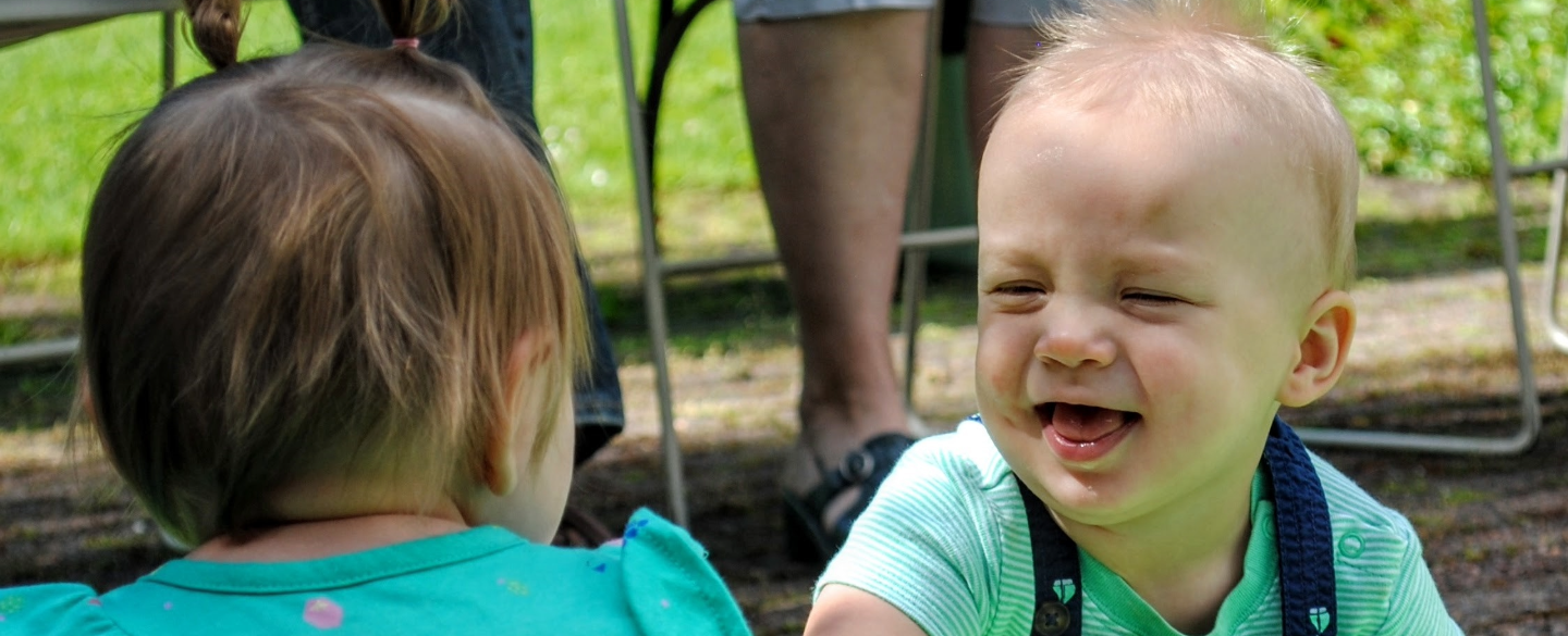 Baby smiling at another baby