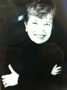 Miriam Johnson, whose beautiful painting of a sunlit woman graces the cover of the 2013 Annual Review. One of the early founders of the center, Miriam Johnson passed away in November 2007. A photograph in the timeline of the printed version of the 2013 Annual Review was incorrectly identified in archived documents.