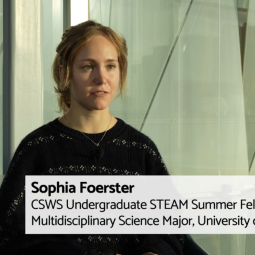 Video still of an interview with a female Caucasian undergraduate researcher.