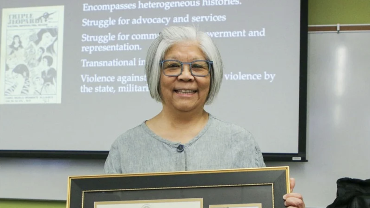 Lynn Fujiwara receiving the Tykeson Teaching Award.