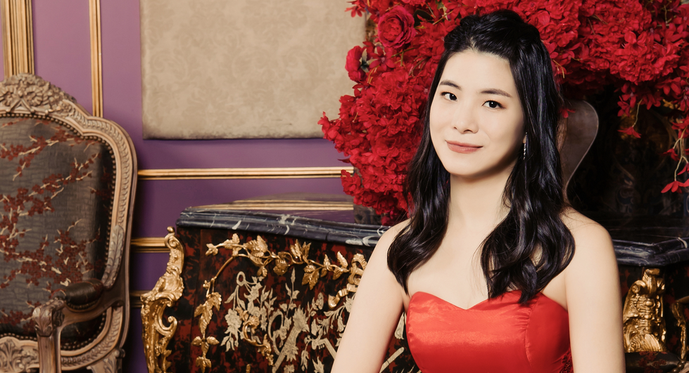 Joyce Chen pictured in a read dress.