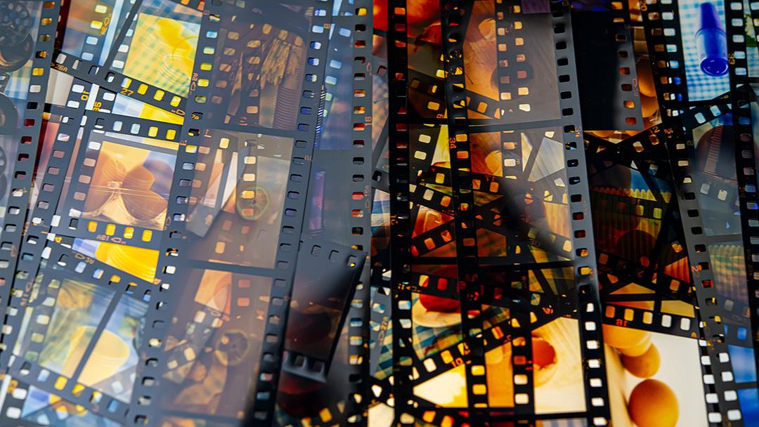 Clips of celluloid film in a pile.