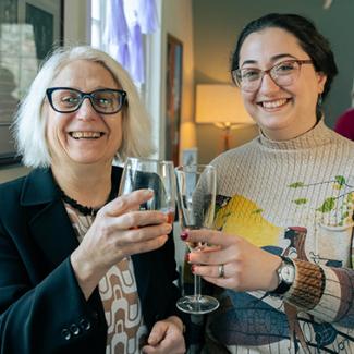 CSWS affiliates raise a glass at the winter CSWS Open House.