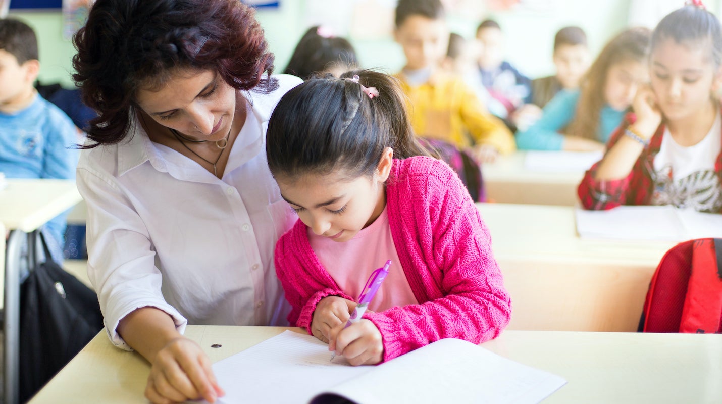 Teacher with students in a class