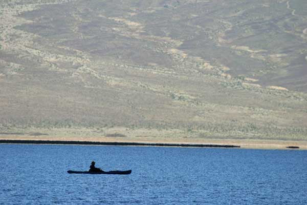 kayaker on flooded salt pan