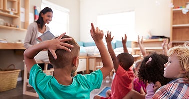teacher in front of a class of students