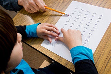 child being assessed with dibels