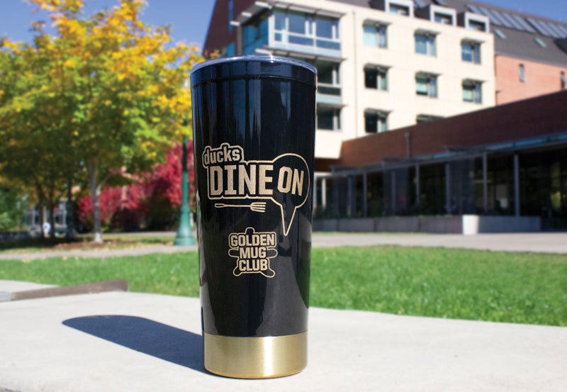 Ducks Dine On golden mug
