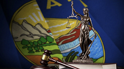 montana state flag with scales of justice