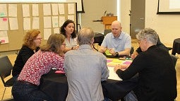 UO faculty members work together at a May 2019 symposium kicking off the Resilience Initiative, which supports interdisciplinary research addressing social and environmental challenges. Seven teams recently received seed funding grants.