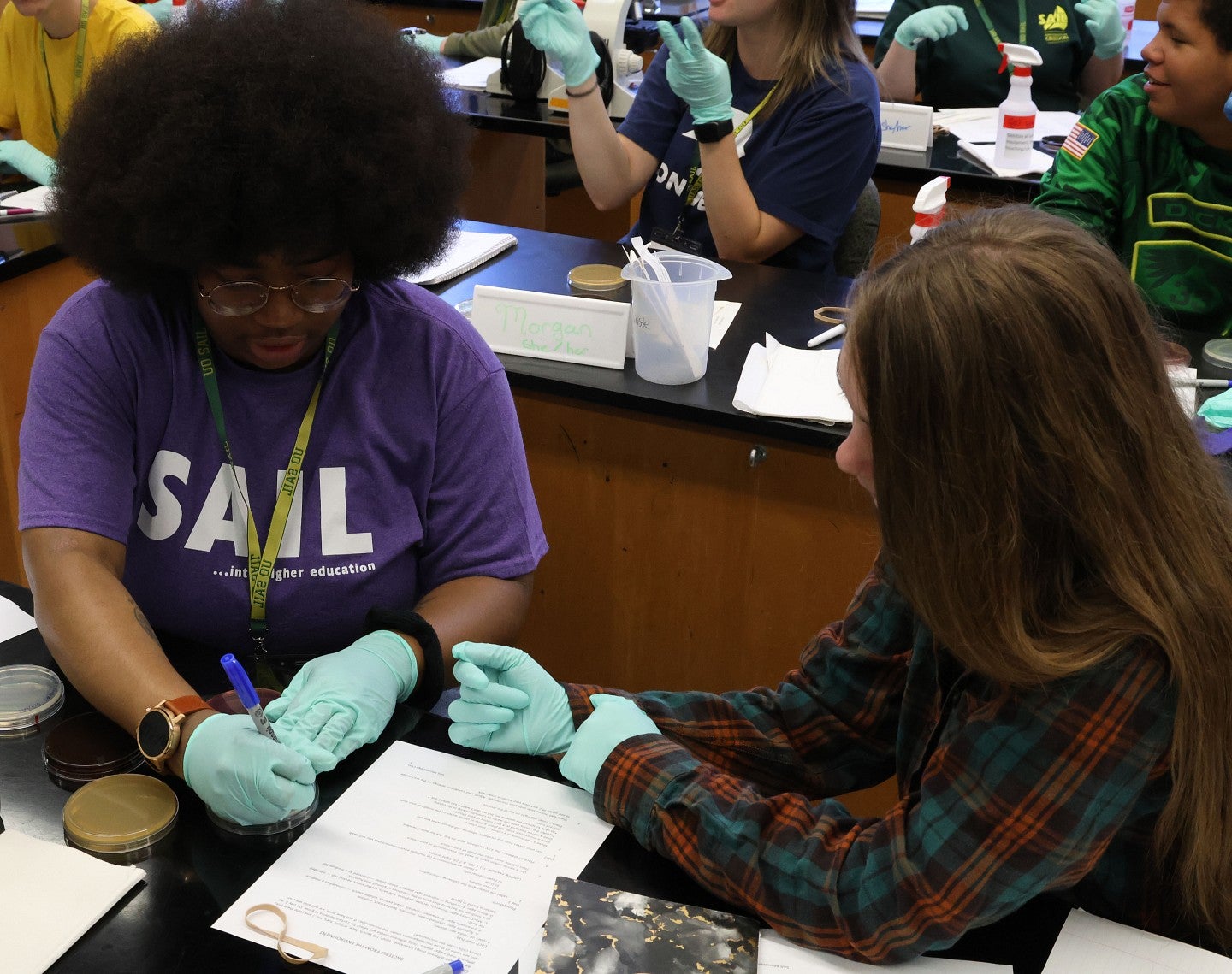 Two SAIL students working together in a science lab environment.