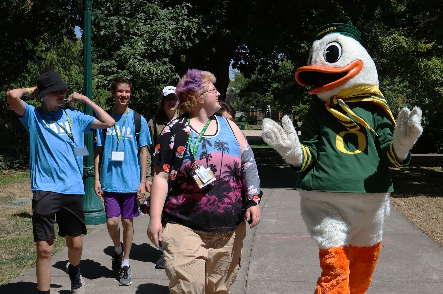 SAIL students walk alongside UO mascot" The Duck"