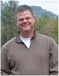 Man with trees in the background