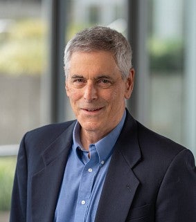 Man in suit in front of window