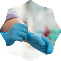 Person putting on medical gloves