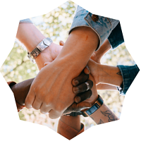 Group of people putting hands in the center