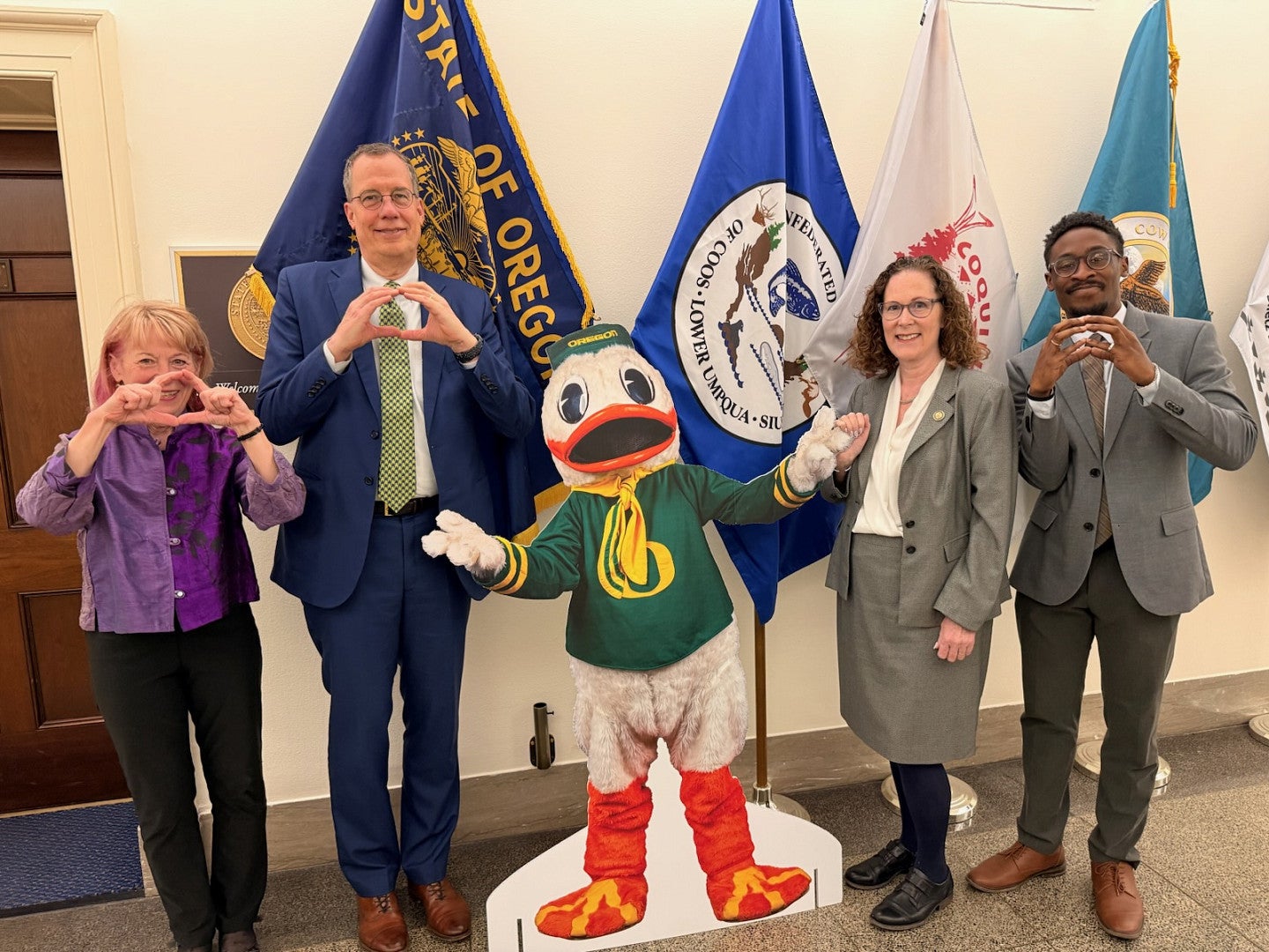 UO President Karl Scholz and Vice President for Research and Innovation Geri Richmond pose for a photo with Oregon Congresswoman Val Hoyle
