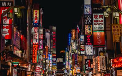 Famous walkway in Tokyo, at night with lit up signs