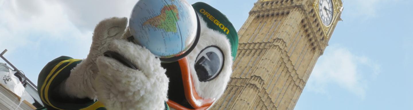  The Oregon Duck holding a globe in front of Big Ben in London