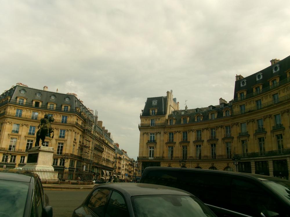 Street view of Parisian architecture on a cloudy day