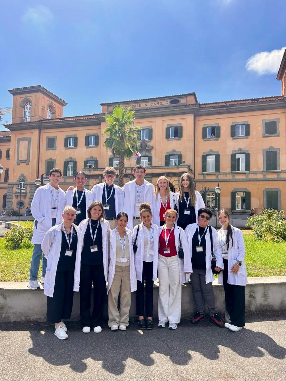 Group of student interns wearing lab coats