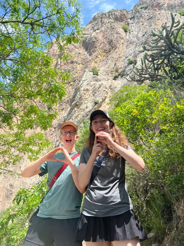 UO Students holding up an O while on a hike