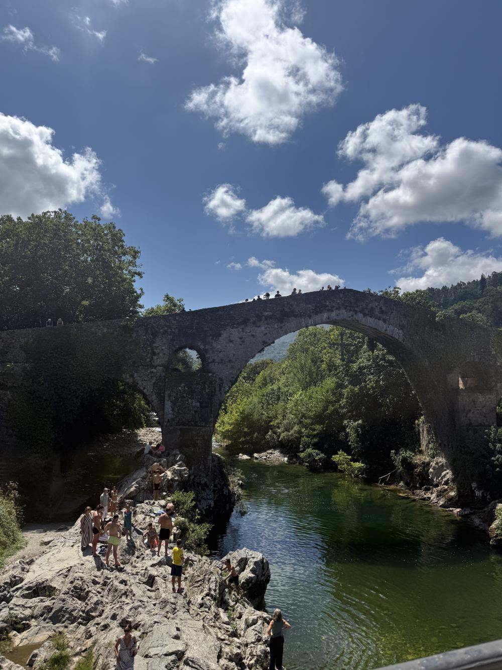 A natural bridge overlooking a river in Oviedo