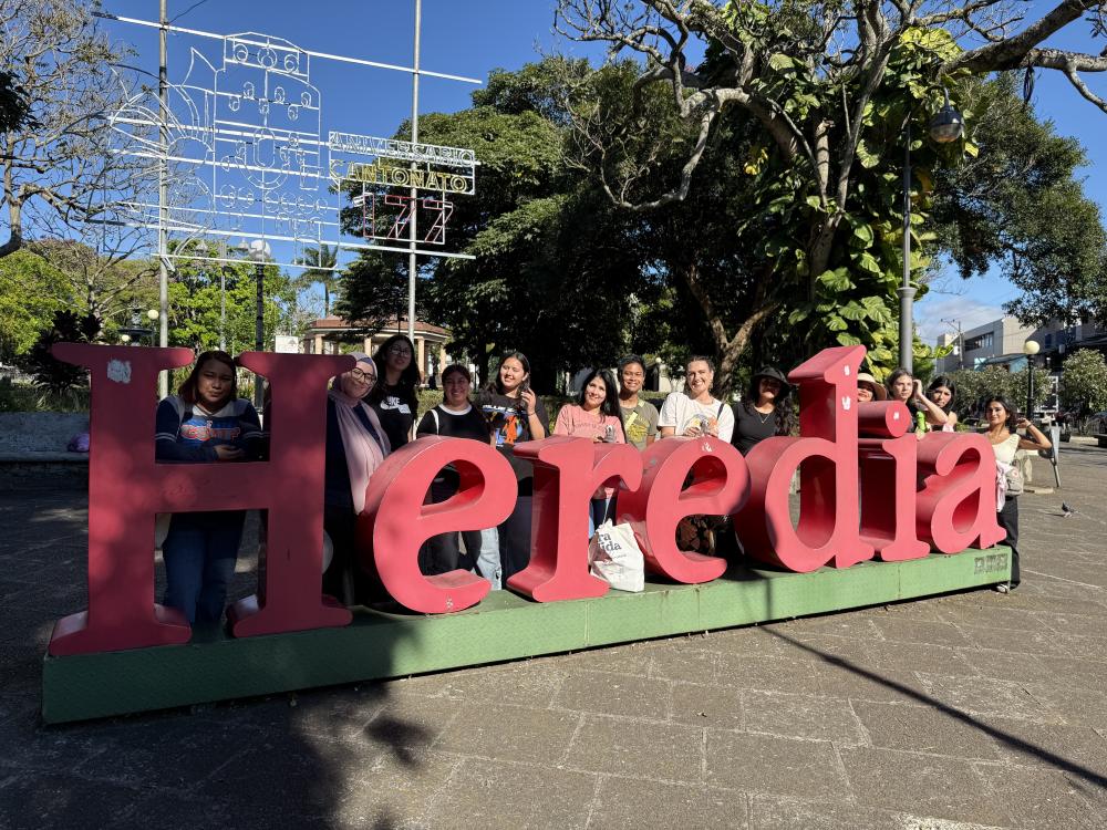 UO students at heredia city sign