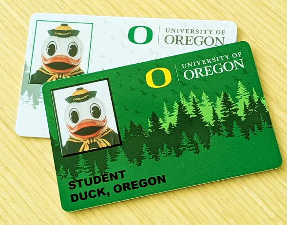 two University of Oregon student ID cards