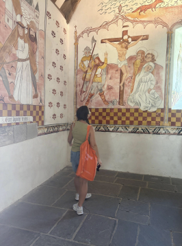 a uo student standing in a ancient welsh church 