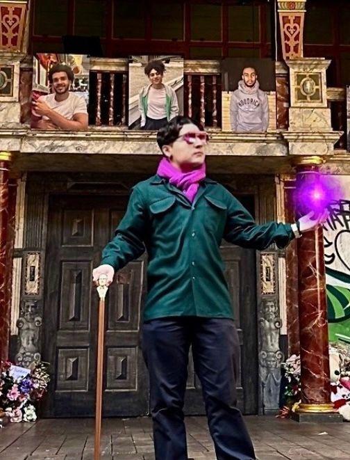 Isaiah posing with a Shakespeare staff holding, an edited purple orb 
