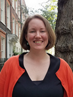Headshot of Amanda standing on a sidewalk in London