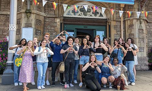 group of college students in front of Bristol train station in the UK