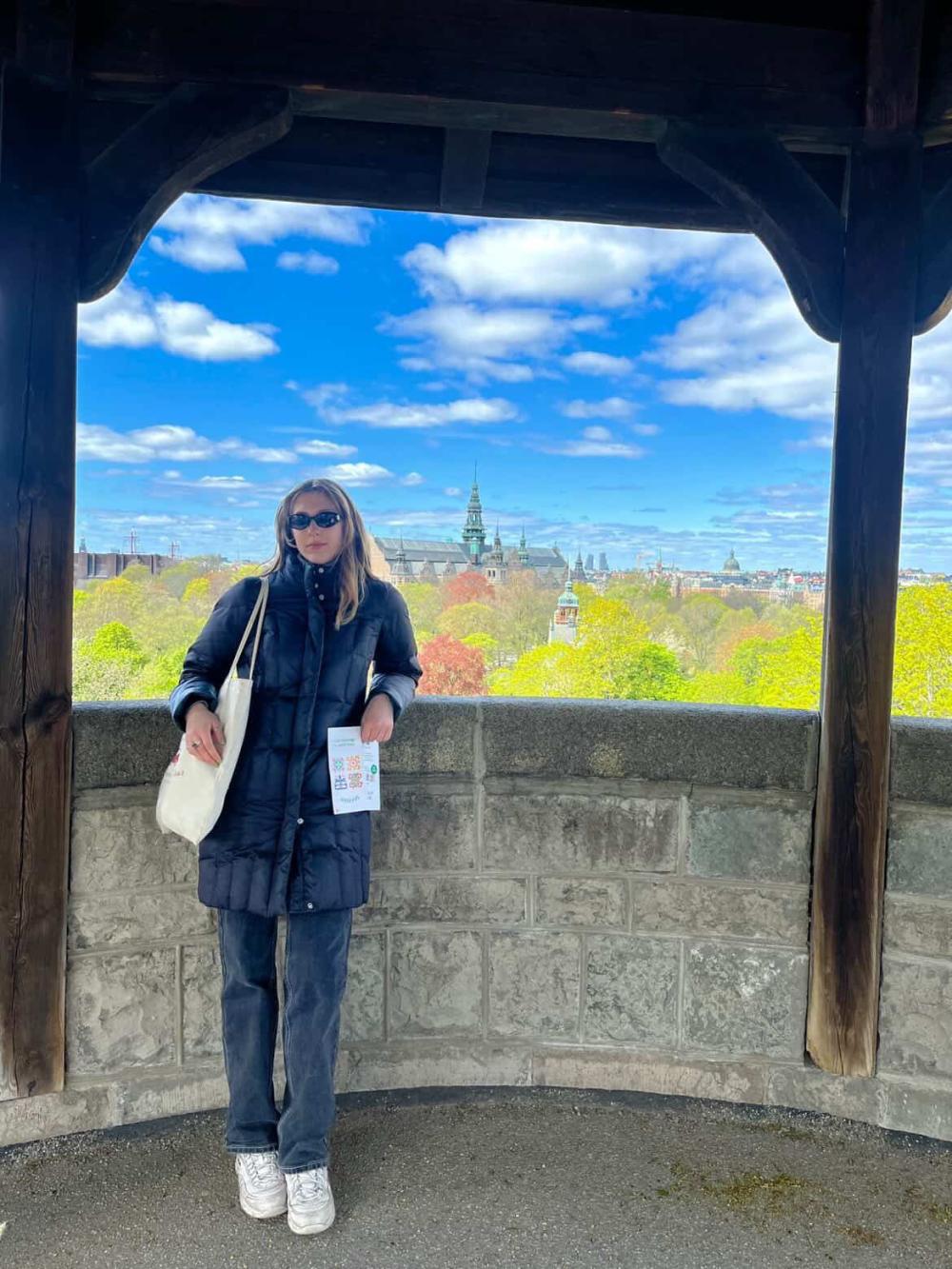Annika posing for a photo on an overlook of Stockholm