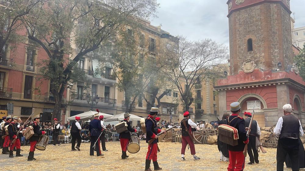 Cultural celebration in the streets of Spain with participants dressed as soldiers or guards