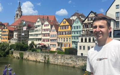 Kaden standing near buildings in Germany