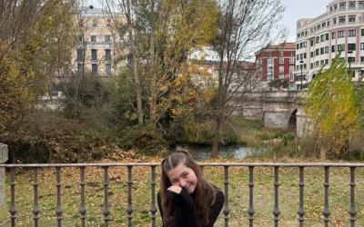 Bailey smiling sitting down in a garden in Spain during the winter