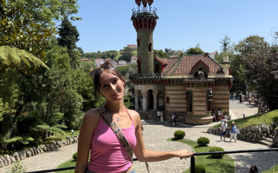 A uo student standing in some gardens