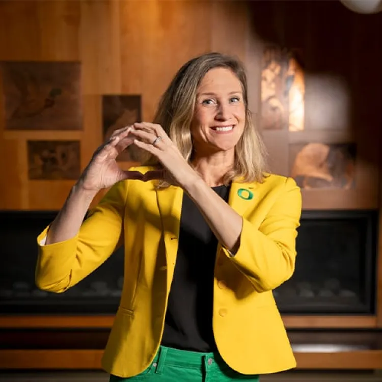  smiling blonde women wearing yellow jacket