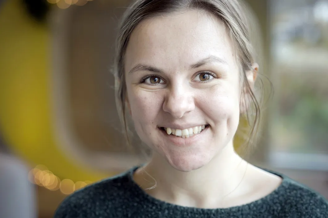 Headshot of Lucy looking at camera and smiling