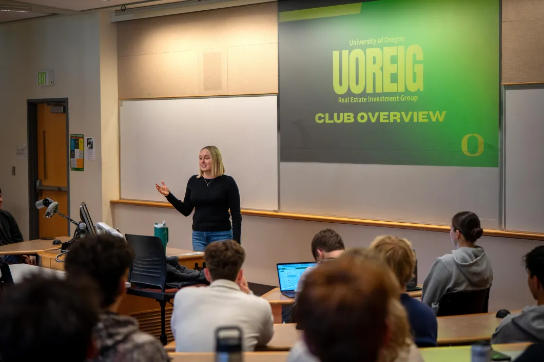 Stella Rabb at a UOREIG meeting speaking in font of a group of students