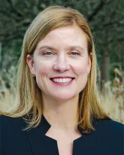 Sharon Heth headshot - smiling blonde, white woman outside